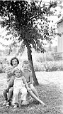 Shirley Escher (rear), Bill Escher (right), and their cousin Mary Klassy (left), and unidentified child (front), circa 1950.